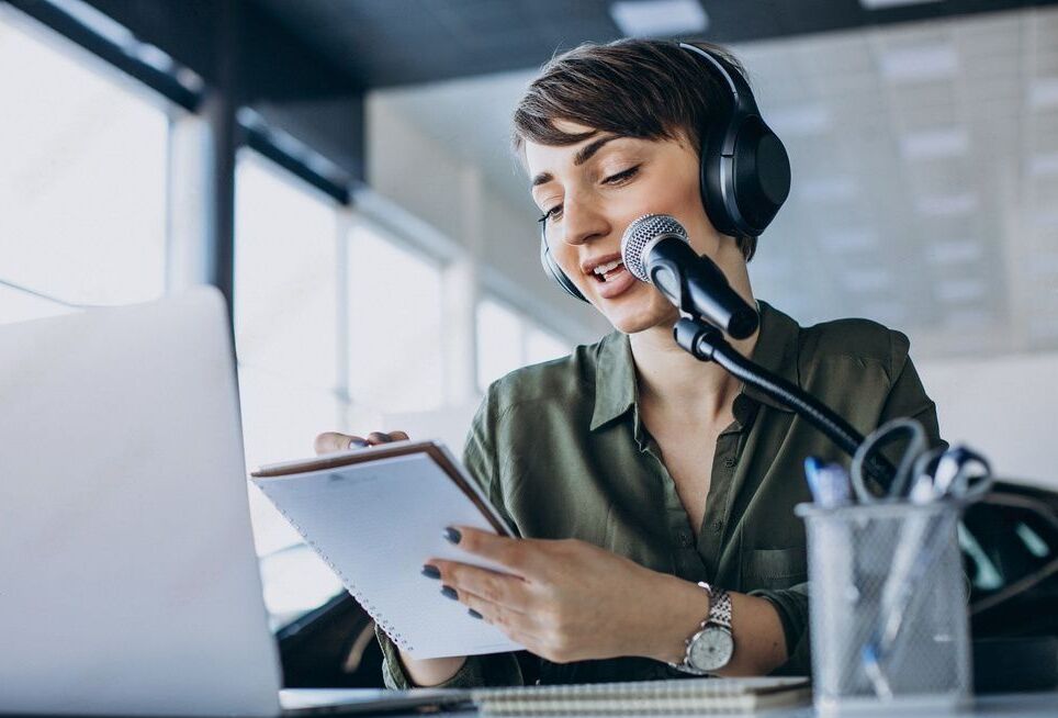 Conference interpreter at the microphone wearing a headset